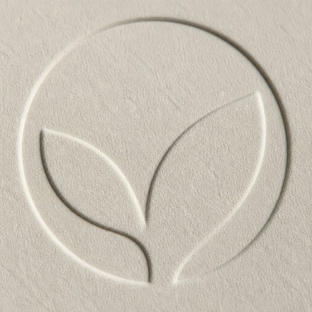 Blind debossed leaf shape pressed into uncoated cream paper