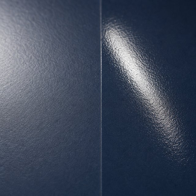 Two halves of the same navy paper, matte on the left, gloss on the right